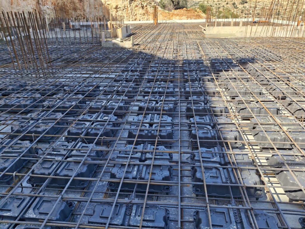 DMAX voided slab system installation with reinforcement steel on a construction site