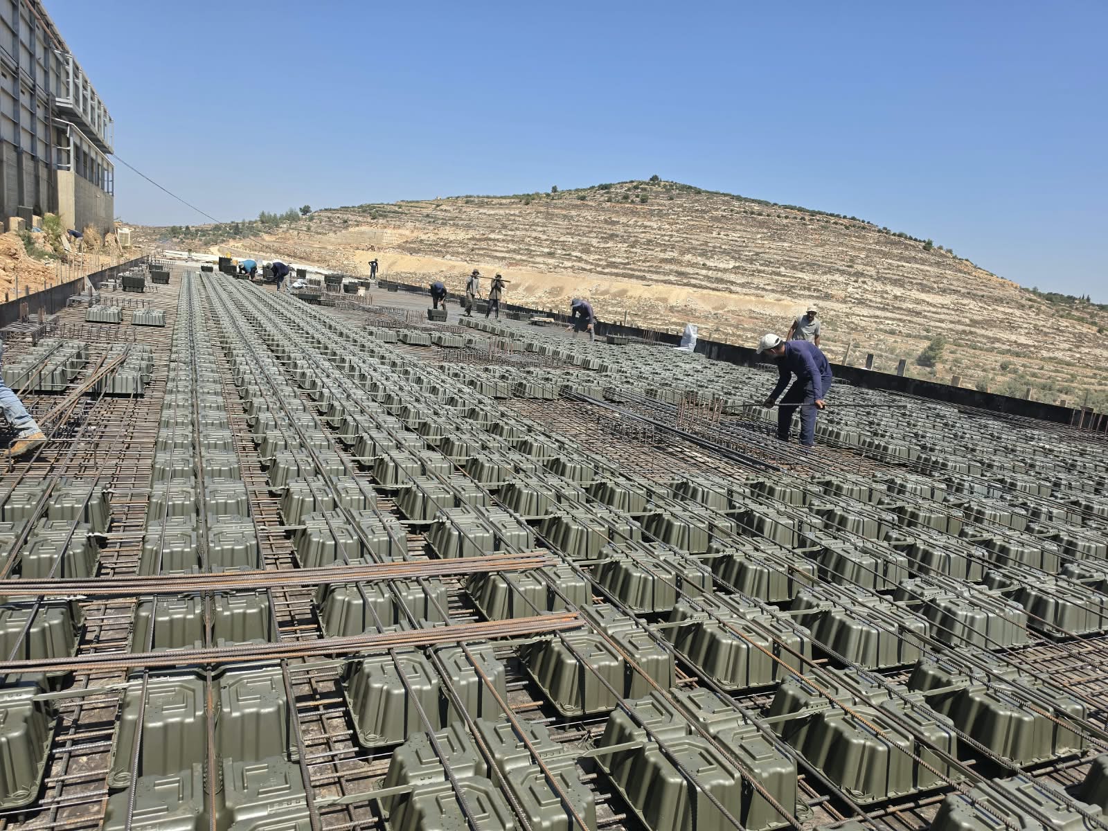 D-MAX voided slab installation with reinforcement steel on a construction site